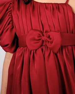 Faye Maroon Puffball Dress with asymmetrical sleeves and a balloon hemline.