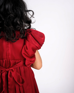 Faye Maroon Puffball Dress with asymmetrical sleeves and a balloon hemline.