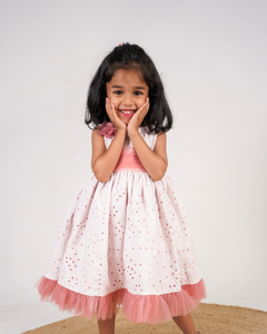 Faye Blush Eyelet Net Peep Out Dress with net frills and a floral bloom.