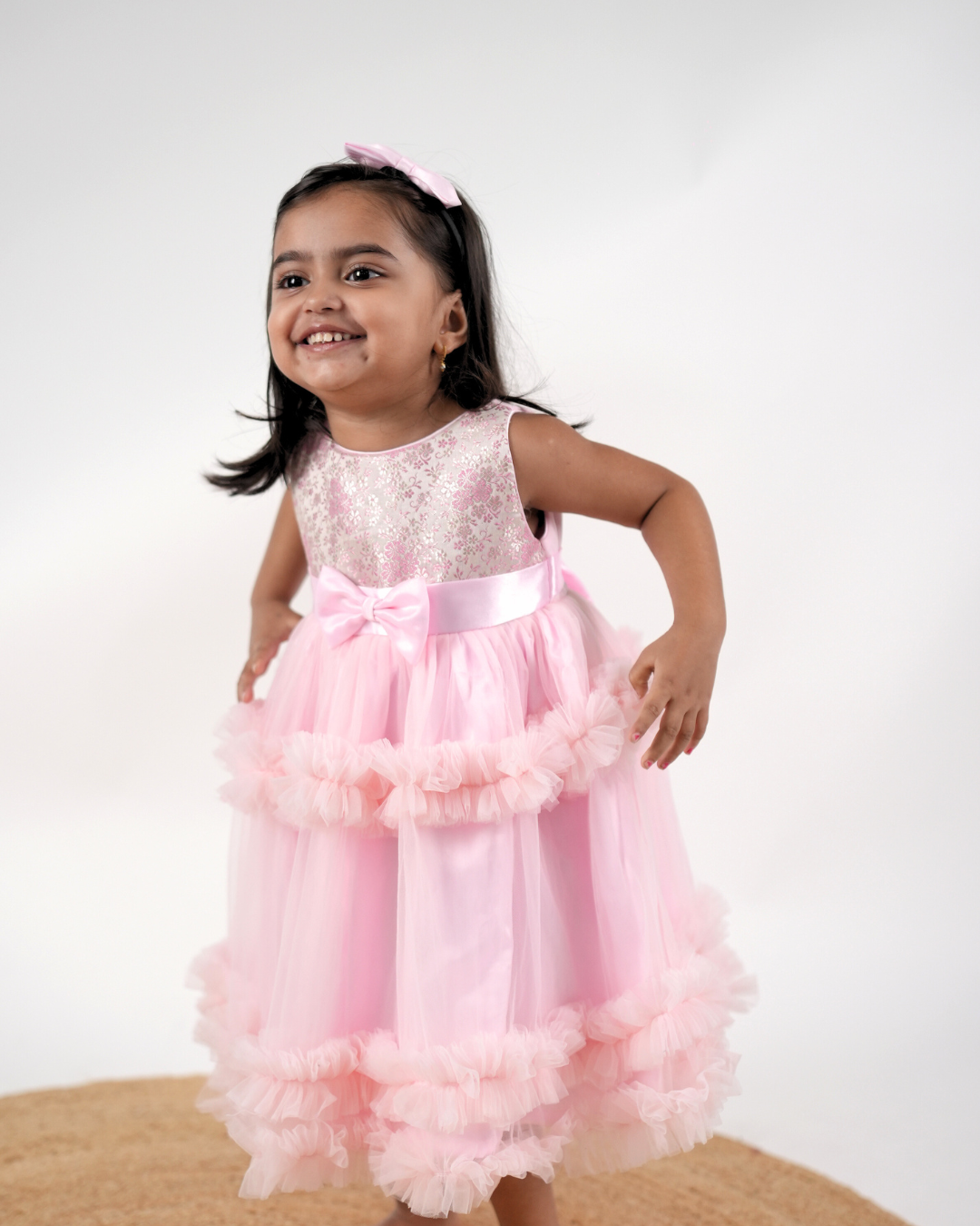 Faye Pink Jacquard Tiered Dress with ruffles and a bow