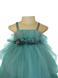 A strappy dress in Agean Teal green colour made of net gathered at the waist with flowers 