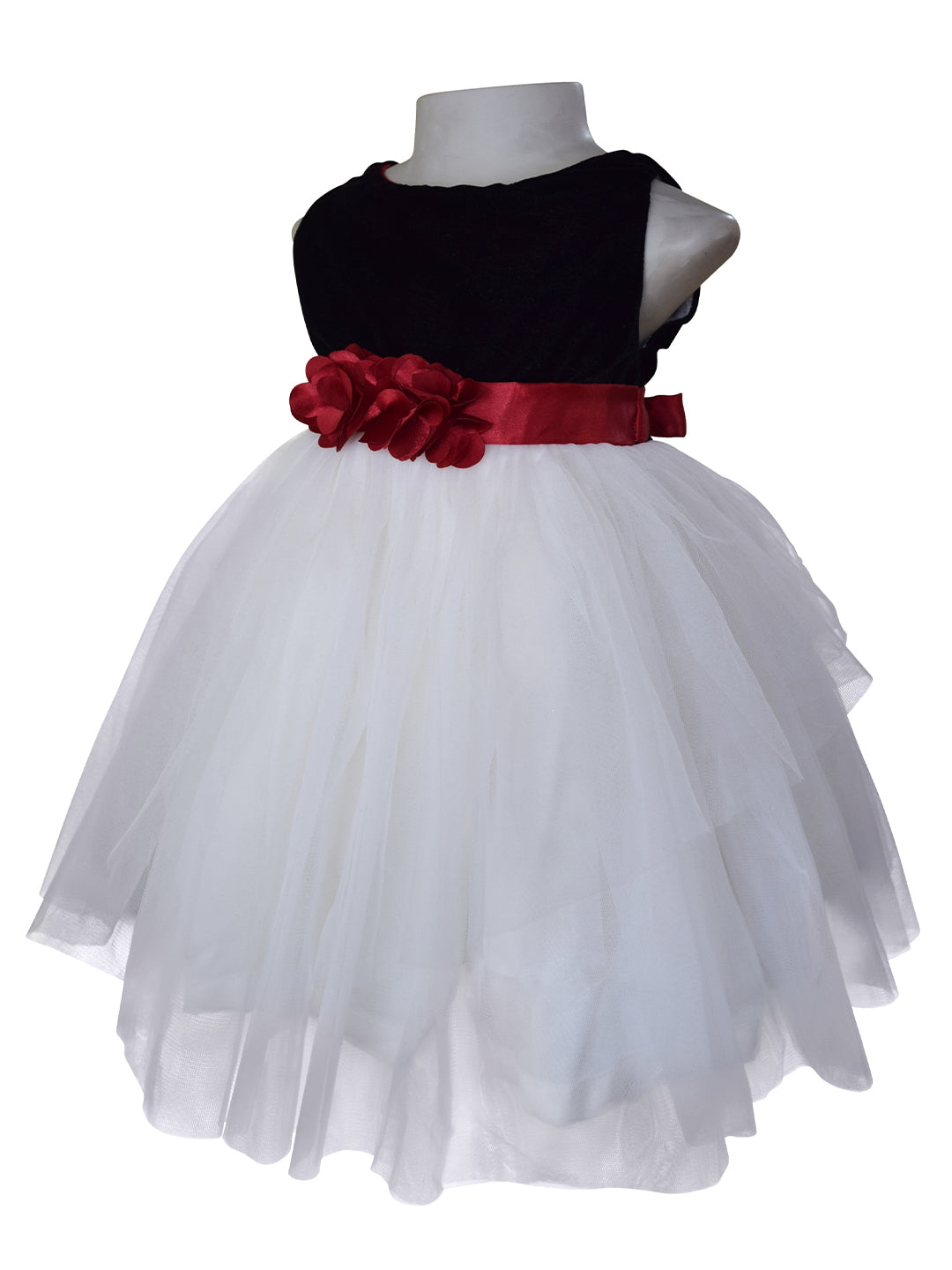A dress for little girls featuring a black velvet bodice & Ivory net skirt with Maroon satin sash and flowers