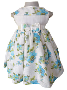 A dress for baby girls from Faye in blue pastel printed floral Lace with satin sash  and double bow.