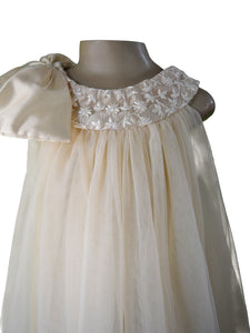 Faye Champagne Lace-Net Swing Dress with oversized bow.