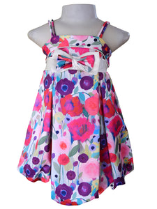Floral satin dress with satin double straps. The waist banded with a
centred oversized double bow. The skirt is bouncy with a bubble hemline.