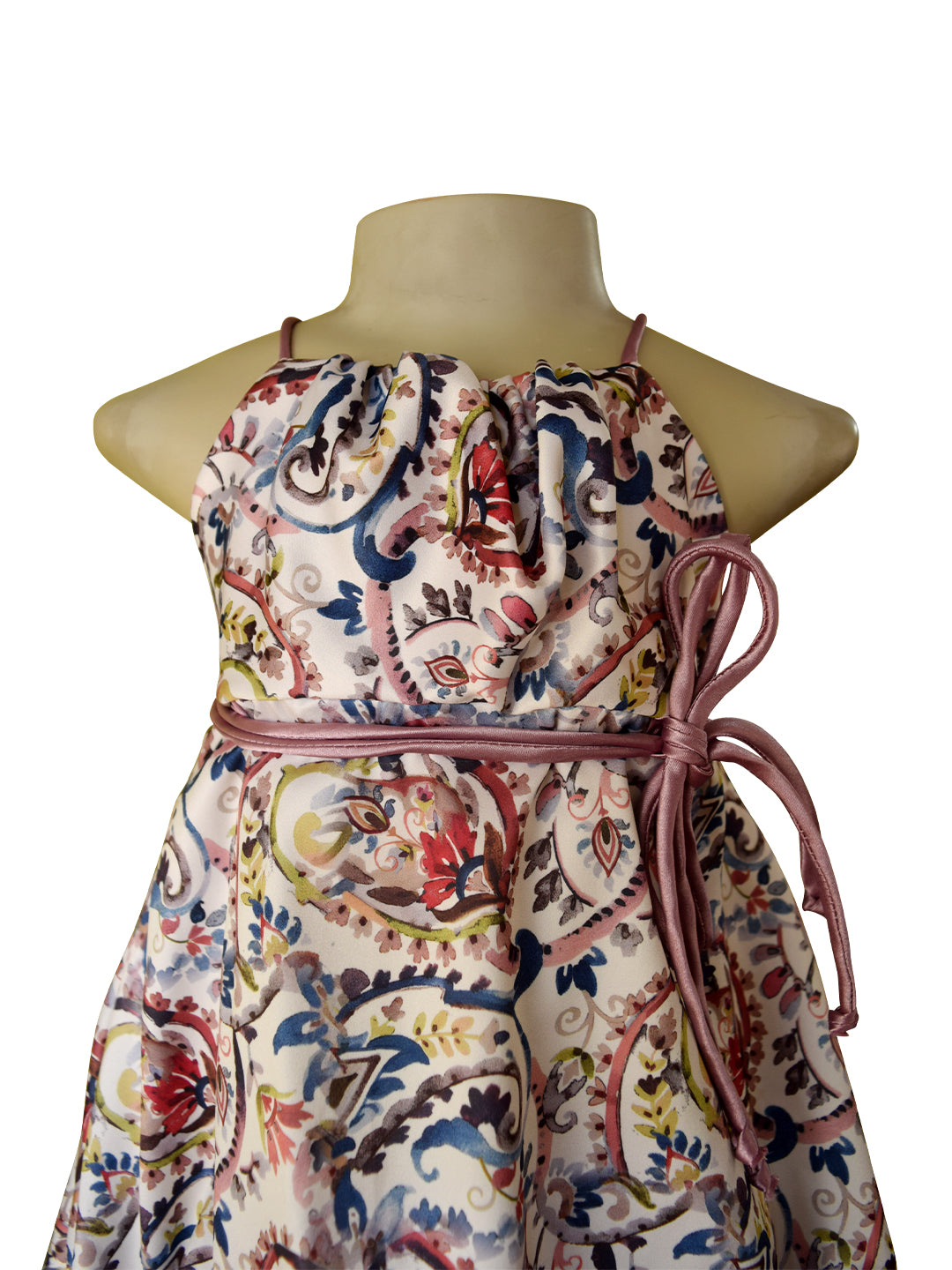Mauve printed satin dress with a ruched bodice and mauve satin straps. The skirt is bouncy with a
bubble hemline. 