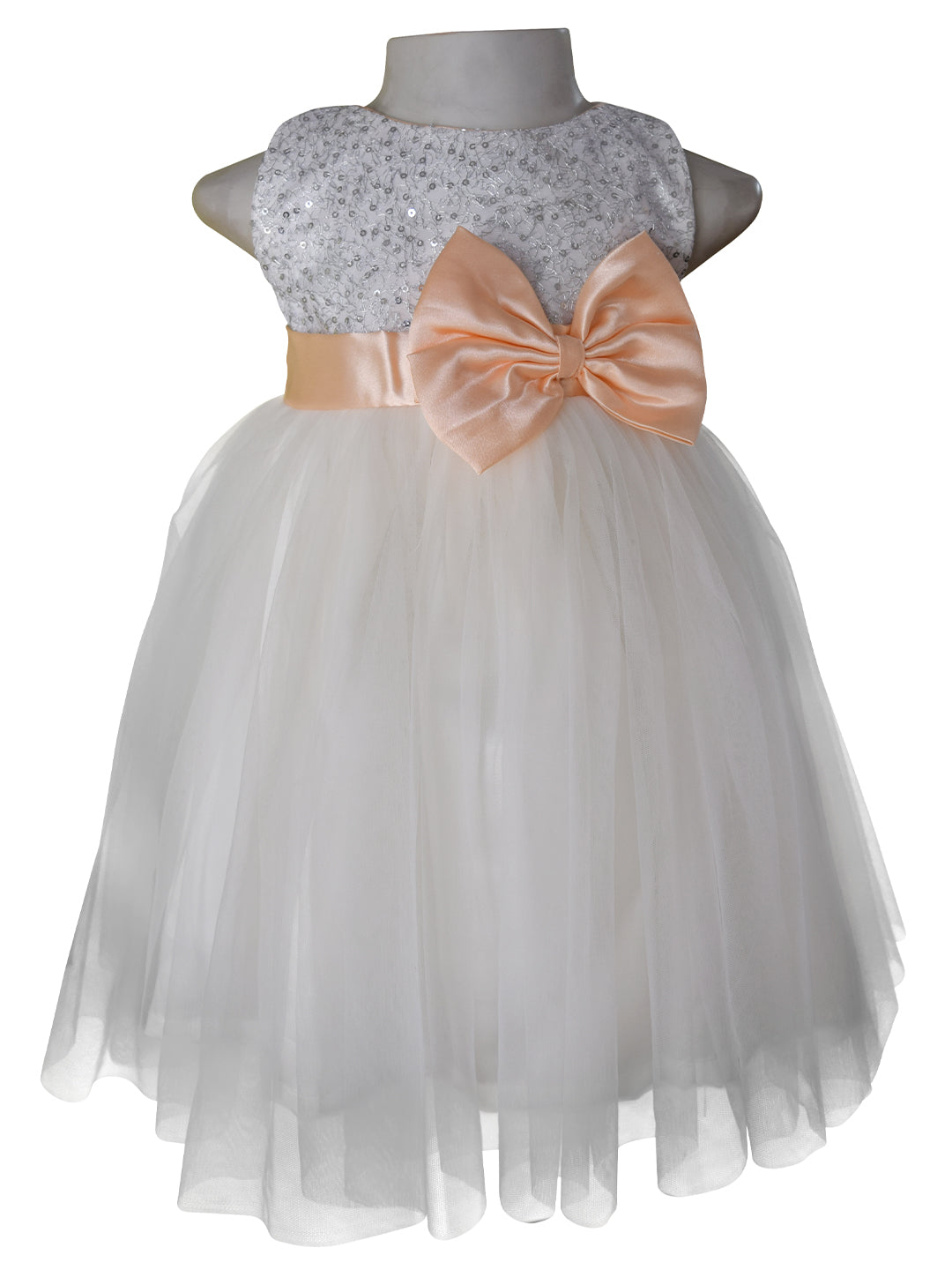 Kids dress in Silver Sequin bodice and Ivory net with Peach colour sash & bow at the waist