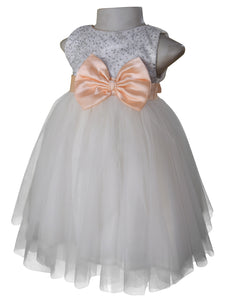 A dress for little girls from faye in Silver Sequin bodice and Ivory net with Peach colour sash & bow at the waist