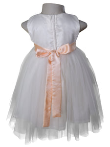 Back view of a kids dress in Ivory net with Peach colour sash at the waist