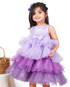 Young girl wearing the Faye Lilac Embroidered Tiered Ombre Dress 